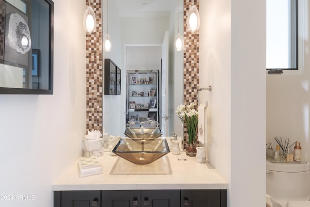 bathroom with toilet and vanity