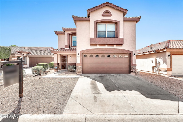 mediterranean / spanish-style house featuring a garage