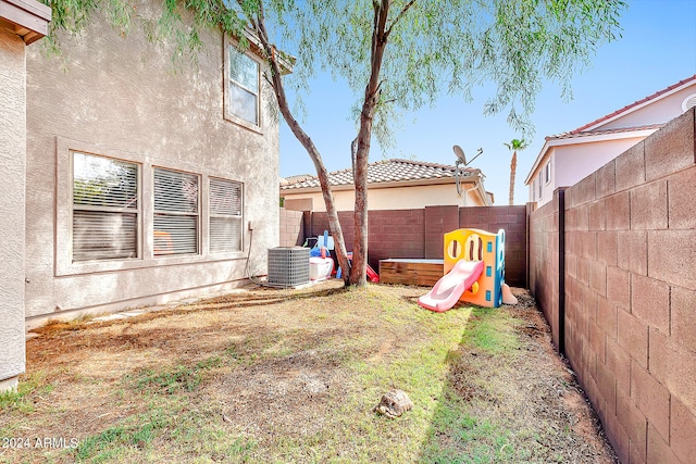 view of yard with central air condition unit