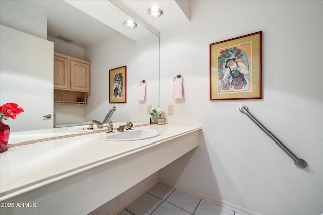 bathroom featuring vanity, tile patterned flooring, visible vents, and baseboards