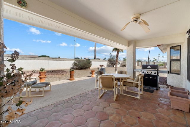 view of patio / terrace with a ceiling fan, outdoor dining area, a fenced backyard, and a grill