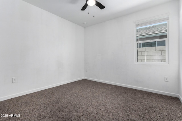 unfurnished room featuring ceiling fan and dark colored carpet