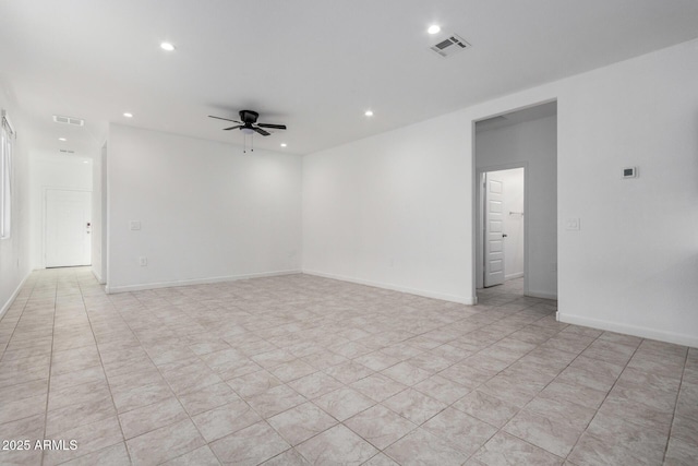 unfurnished room with ceiling fan and light tile patterned floors