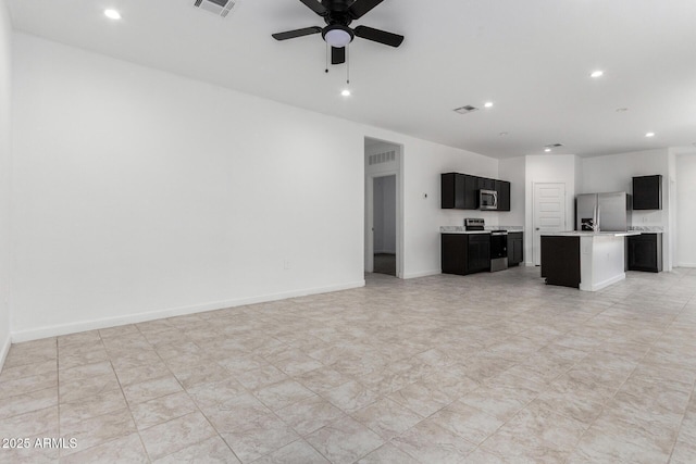 unfurnished living room with ceiling fan