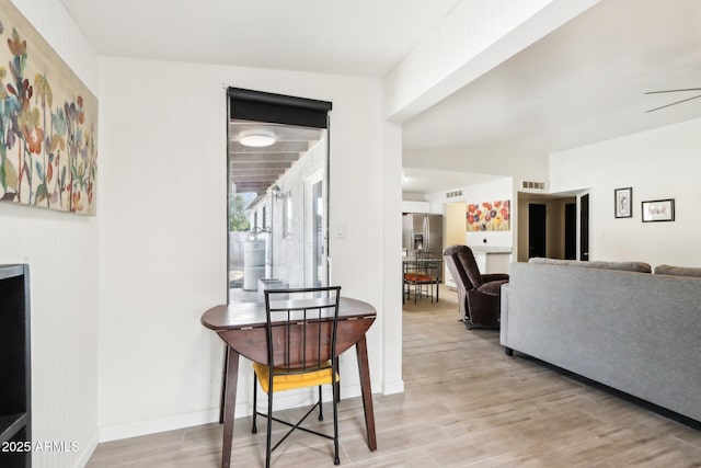 dining area with light hardwood / wood-style floors