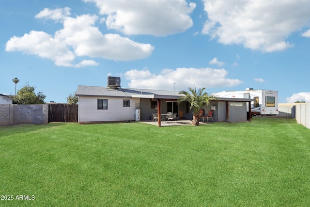 back of property with a patio and a lawn