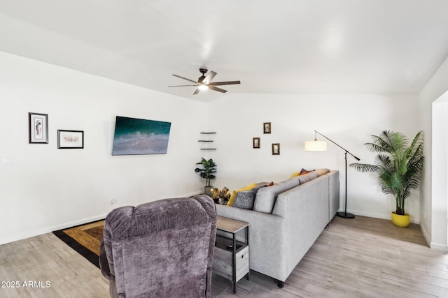 living room with wood-type flooring, vaulted ceiling, and ceiling fan