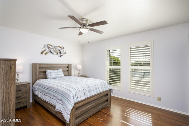 bedroom with dark wood-type flooring and ceiling fan