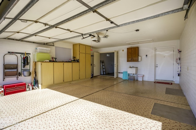 garage with a garage door opener and sink