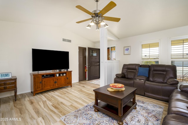 living room with vaulted ceiling, ceiling fan, and light wood-type flooring