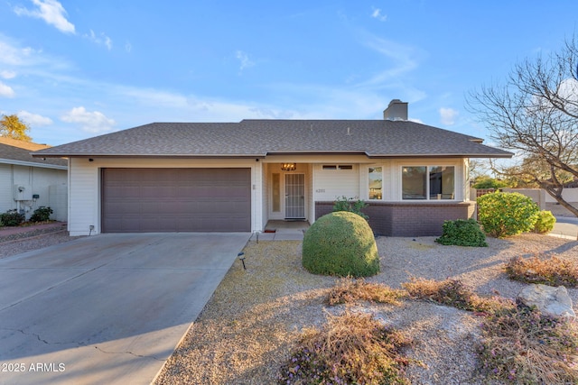 ranch-style home featuring a garage