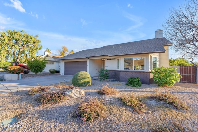 ranch-style home featuring a garage