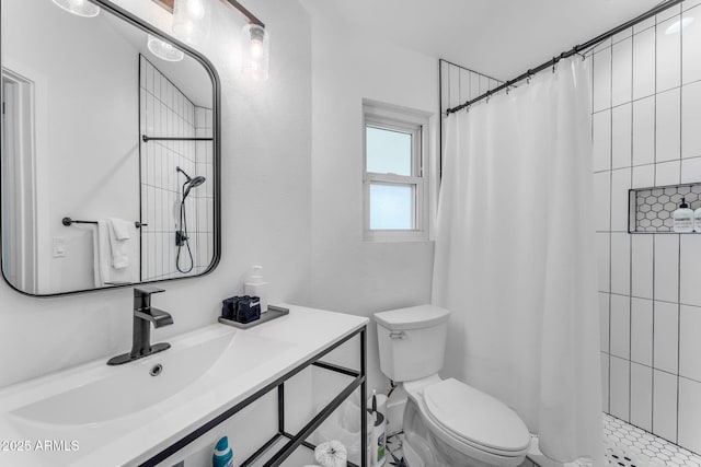 bathroom featuring vanity, curtained shower, and toilet