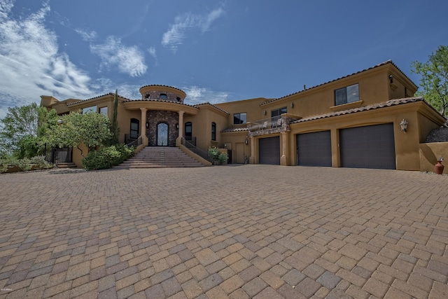 mediterranean / spanish-style home featuring a garage