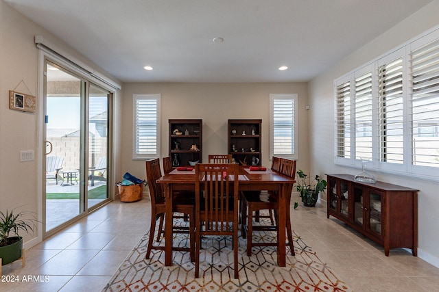 dining room featuring plenty of natural light and light tile patterned floors