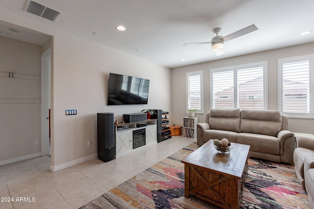 tiled living room featuring ceiling fan