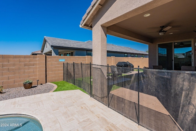 view of patio / terrace featuring ceiling fan