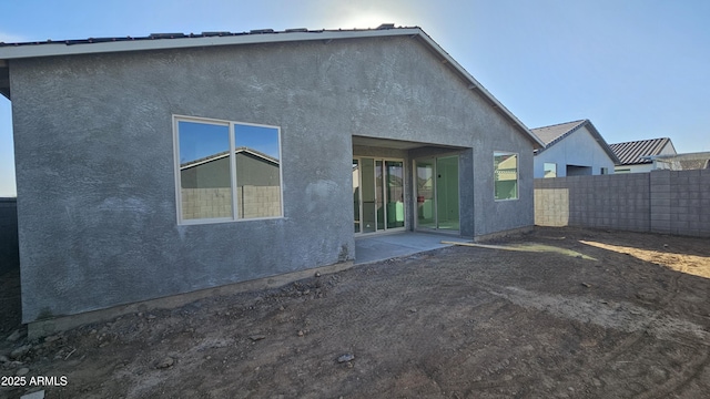 back of property with a patio area