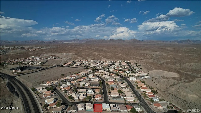 birds eye view of property featuring a mountain view