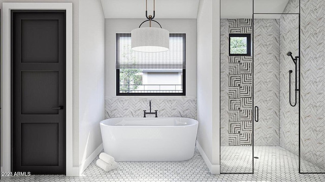 bathroom with independent shower and bath, tile walls, and tile patterned flooring