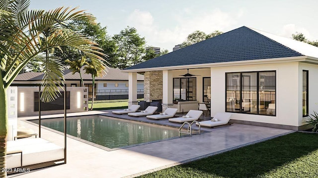 view of swimming pool with a patio area, a yard, and ceiling fan