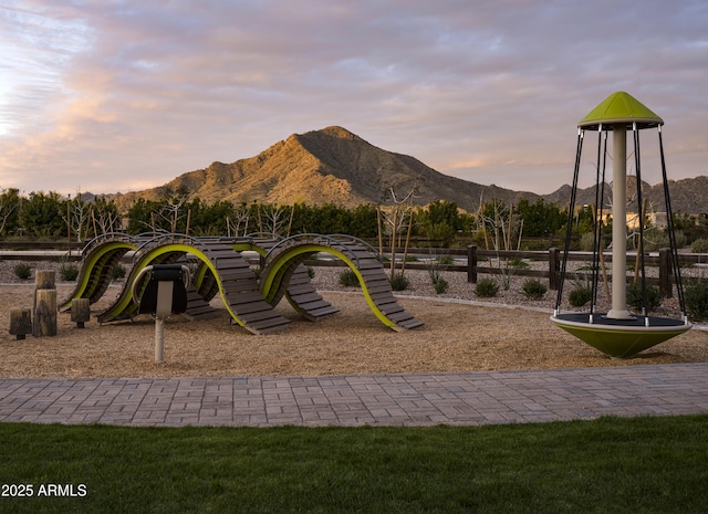 view of jungle gym featuring a mountain view