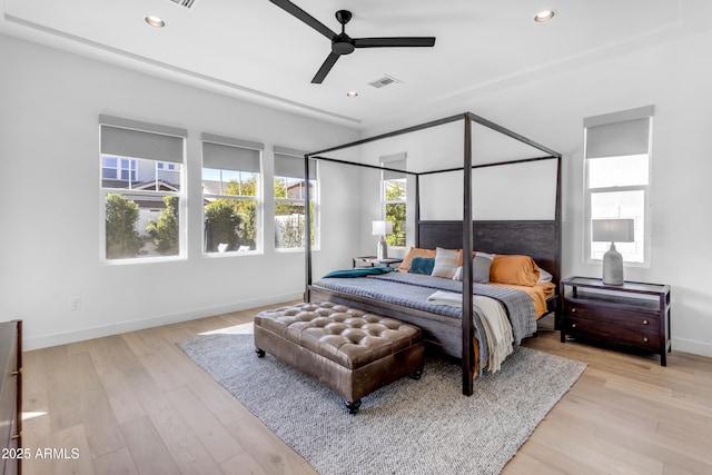 bedroom featuring visible vents, light wood-style flooring, recessed lighting, baseboards, and ceiling fan