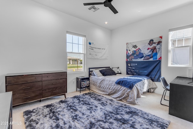 bedroom with ceiling fan, recessed lighting, visible vents, and light carpet