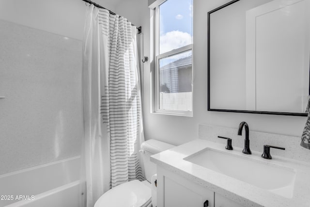 full bathroom featuring toilet, shower / tub combo with curtain, and vanity