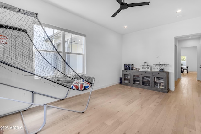 interior space with recessed lighting, baseboards, a ceiling fan, and hardwood / wood-style floors