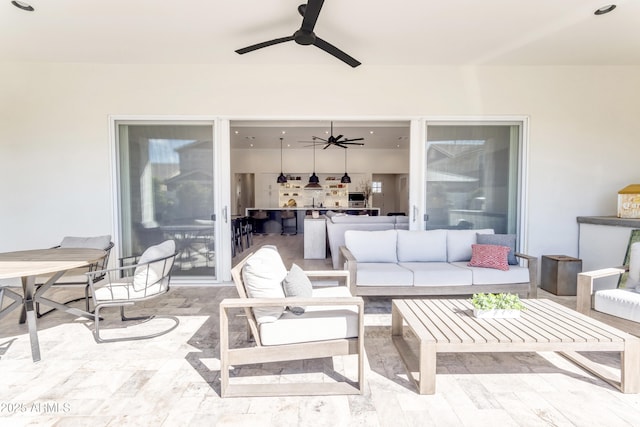 view of patio / terrace with outdoor lounge area and a ceiling fan