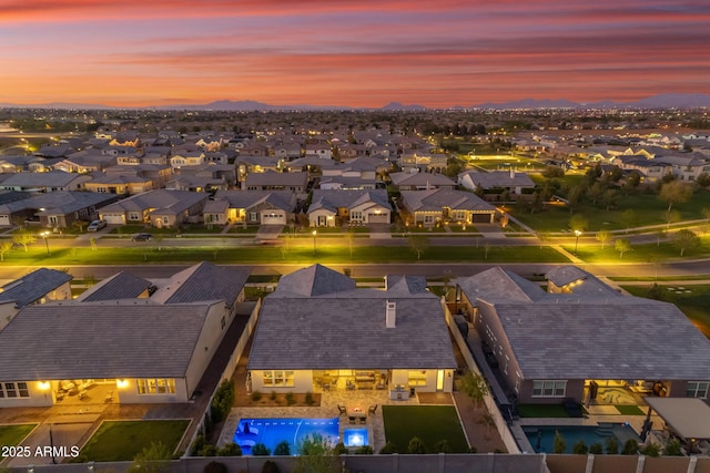 aerial view at dusk with a residential view