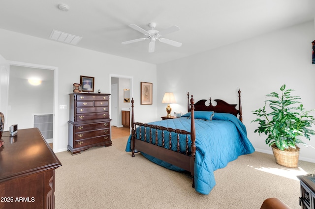 bedroom featuring a ceiling fan, carpet, visible vents, and ensuite bathroom