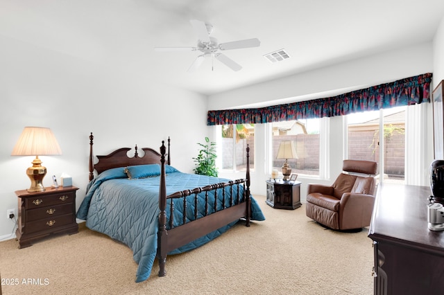 bedroom with visible vents, carpet floors, multiple windows, and ceiling fan