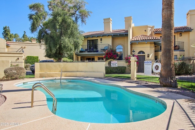 community pool featuring fence