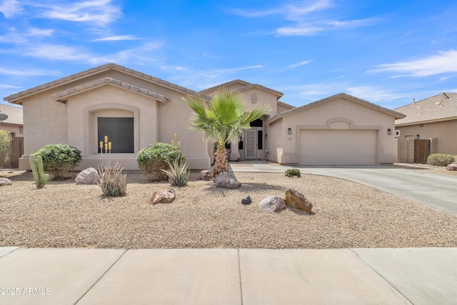 43271 W Little Dr, Maricopa, AZ 85138 - view of front of home with a garage, driveway, and stucco siding