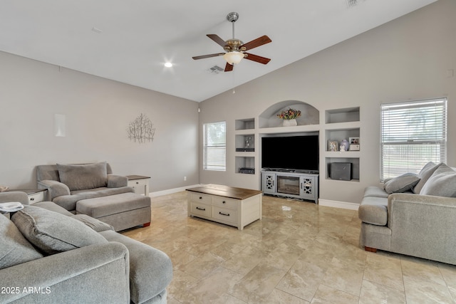 43271 W Little Dr, Maricopa, AZ 85138 - living area with a ceiling fan, baseboards, high vaulted ceiling, and built in shelves