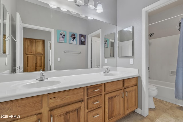 43271 W Little Dr, Maricopa, AZ 85138 - bathroom with double vanity, shower / bath combo with shower curtain, toilet, and a sink