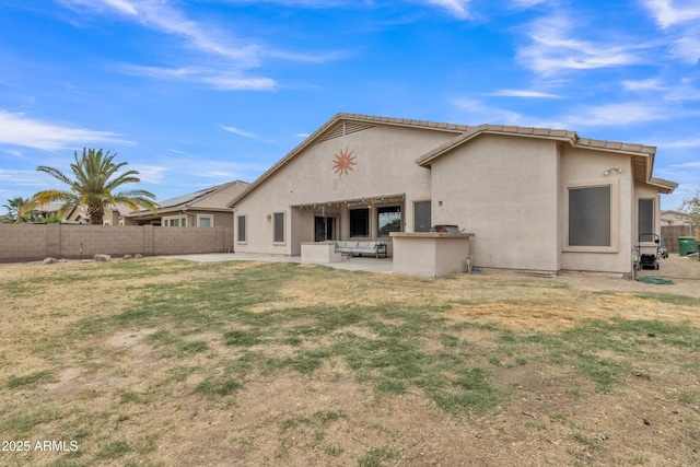 43271 W Little Dr, Maricopa, AZ 85138 - rear view of property featuring fence, stucco siding, and a patio