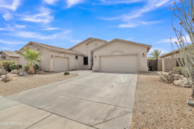 43271 W Little Dr, Maricopa, AZ 85138 - ranch-style house with stucco siding, driveway, fence, and a garage