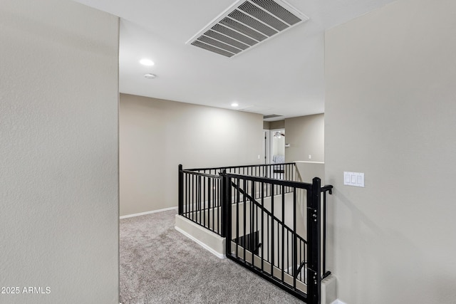 hallway with carpet floors