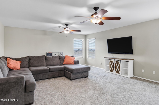 carpeted living room featuring ceiling fan