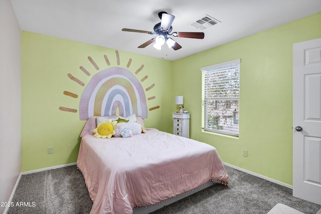 bedroom featuring ceiling fan and dark carpet