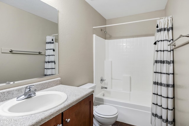 full bathroom featuring vanity, shower / bath combination with curtain, and toilet