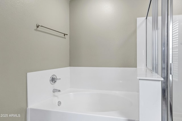 bathroom with a washtub