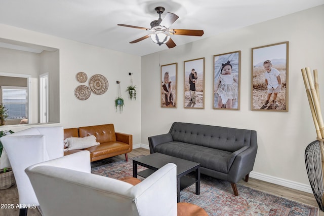 living room featuring hardwood / wood-style flooring and ceiling fan