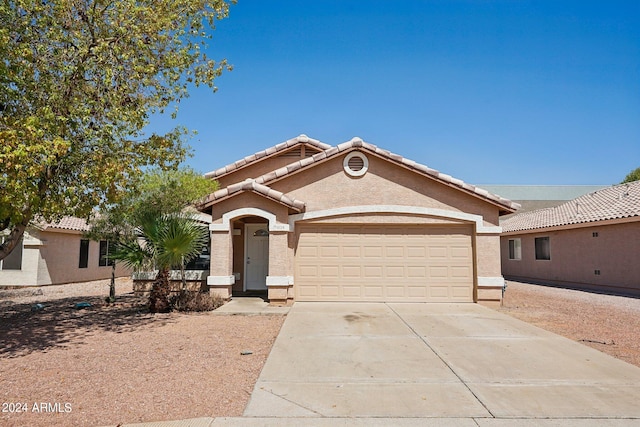 view of front of property with a garage