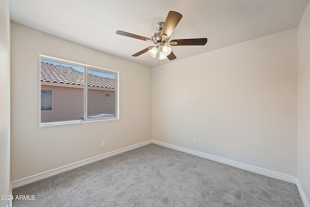 unfurnished room featuring carpet floors and ceiling fan