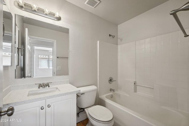 full bathroom with shower / washtub combination, vanity, and toilet