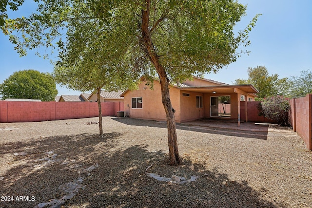 rear view of property featuring a patio